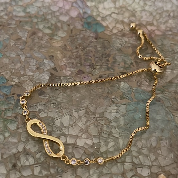 Gold Infinity bracelet with CZ sparkly stones NWOT Toggle adjustable - Picture 2 of 8